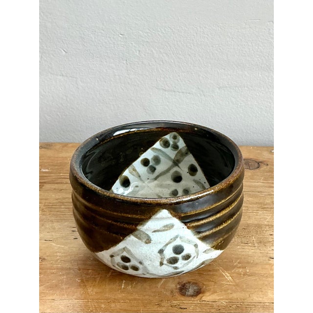 This exquisite vintage studio pottery bowl is a masterwork of tactile form and graphic glaze work. Hand-thrown with a...