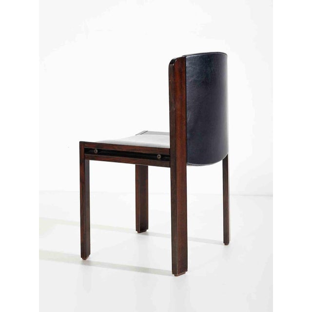 Four chairs created by joe colombo in 1966 for pozzi. Lacquered wood and padded skai. Ref. I colombo. Joe colombo...