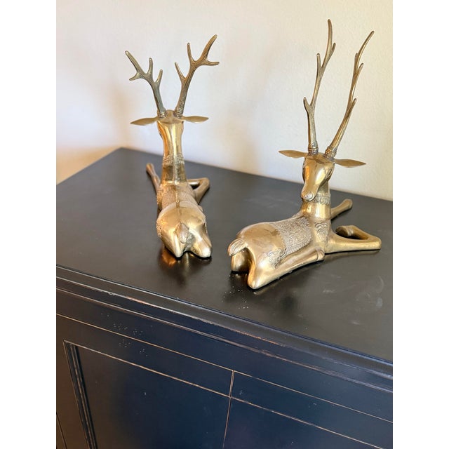 A large and very decorative Vintage Brass Stag Pair in reclining position.Perhaps mythological creatures, each recumbent...