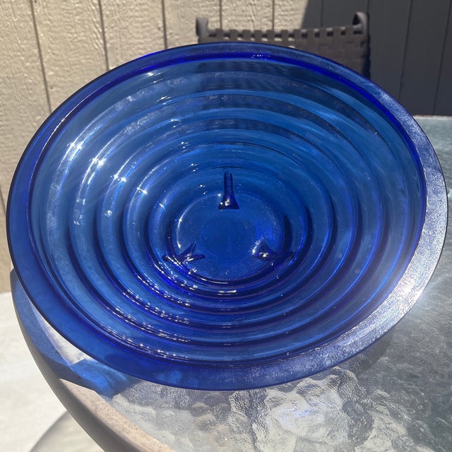 Bold, sculptural, and full of character—this handmade Spanish cobalt blue glass bowl is a true statement piece. Crafted...