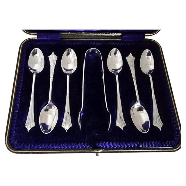 A fine complete Edwardian sterling silver tea service set dating to 1908, comprising tea or coffee spoons accompanied by a...