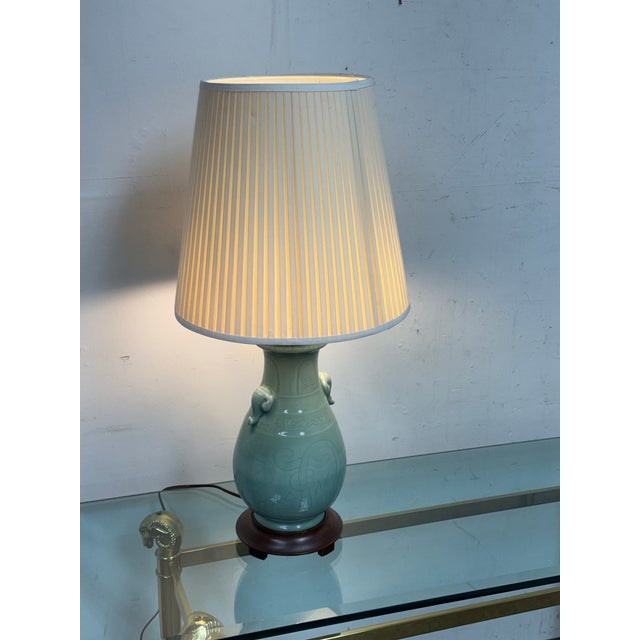Design Plus Gallery presents a Vintage Celadon Table Lamp. This table lamp has a glazed celadon ceramic vase-form body...