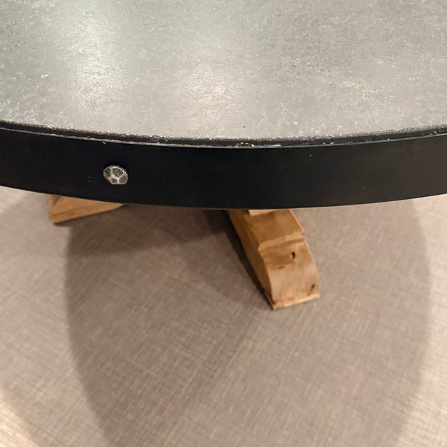 RH Salvaged Wood and Concrete Round Dining Table Timothy Oulton paired a smoothly honed thick concrete top with the...