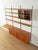A classic shelving system from the 1960s. The high-quality containers and shelves are veneered in teak. The system...