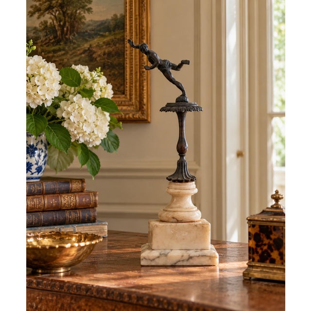 A beautifully composed Grand Tour–style figural sculpture depicting a dynamic classical dancer, mounted on a tiered marble...