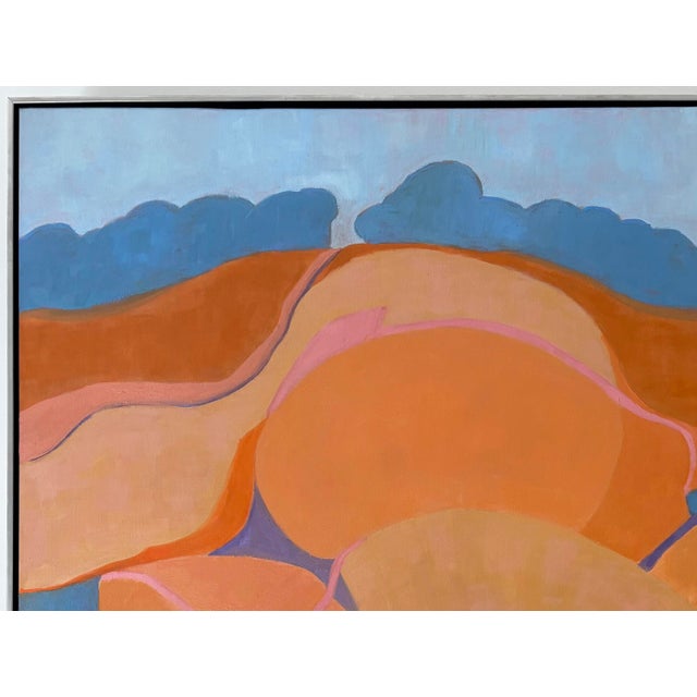An abstract landscape of country fields and a road winding up the hill in beautiful shades of oranges, coral, pink, with...