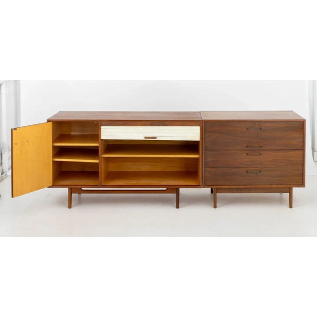 Jens Risom Walnut Two-Piece Credenza, the left side having single cabinet with three shelves and white vinyl tambour door...