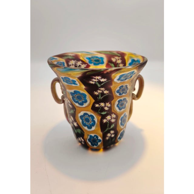 A Masterclass in Murano Glassmaking Crafted around 1910 by the renowned Toso brothers on the island of Murano, this...