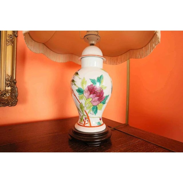 Table lamp on a wooden base with a fabric shade. The lamp is hand-painted, signed Chantal. Fully functional. Very good...