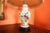 Table lamp on a wooden base with a fabric shade. The lamp is hand-painted, signed Chantal. Fully functional. Very good...