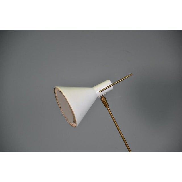 Rare Stilnovo brass floor lamp, Italy, 1950s (published model), Adjustable height and directional shade This piece has an...