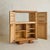 A 1940s French oak bar cabinet, defined by its paneled facade and parquetry veneer. The façade is defined by four doors,...