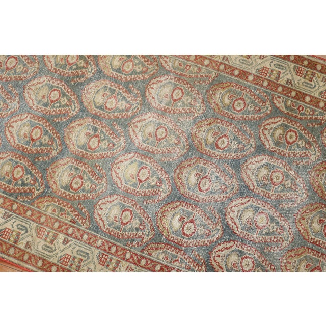 An early 20th-century Persian Malayer runner featuring an all-over paisley design 3'5'' x 16'7''