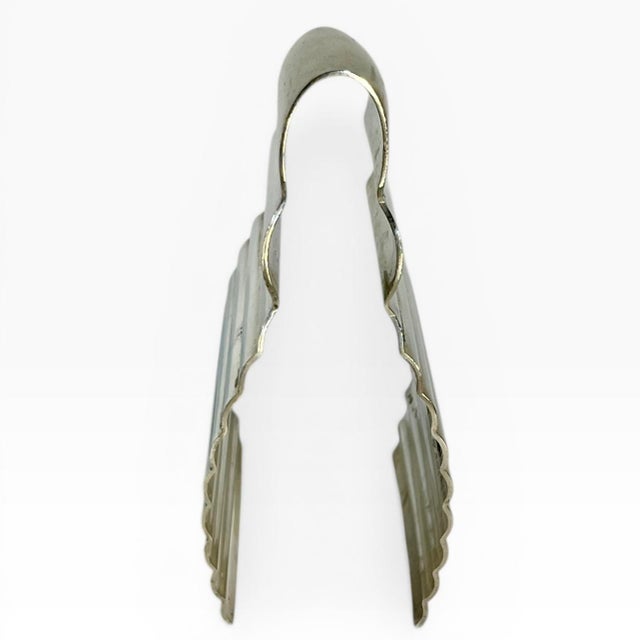 Unique set of asparagus tongs by Christofle in the art deco ondulations pattern. These design is by Luc Lanel from the...