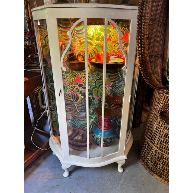 Up for consideration is a beautiful vintage white wooden short glass light up display cabinet with a tropical wallpaper...