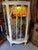 Up for consideration is a beautiful vintage white wooden short glass light up display cabinet with a tropical wallpaper...