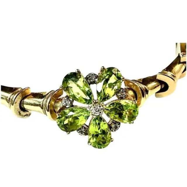 Stunning 14k yellow gold Peridot and Diamond Bracelet. 17.66 Grams TW. Each of the five peridot stones are approximately...