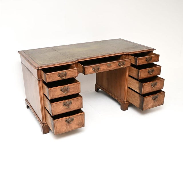 A magnificent, large antique walnut leather top pedestal desk. This was made in England, it dates from around the...