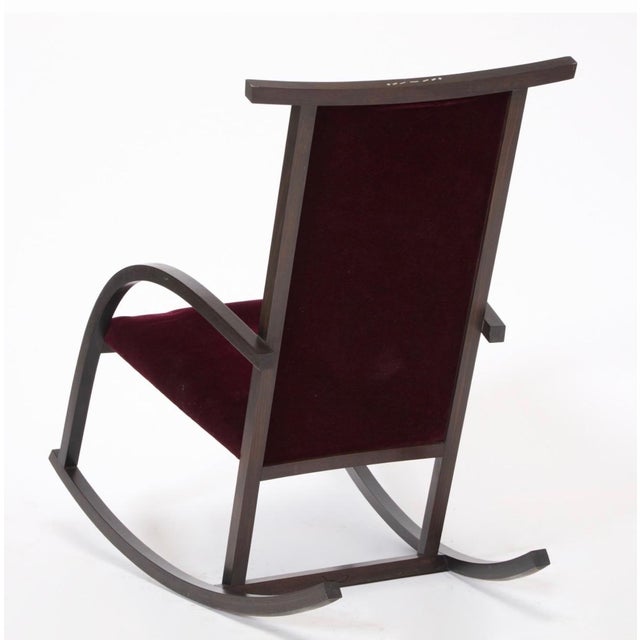 Carlos Riart for Knoll, circa 1982, rocker in stained mahogany with inlaid of mother of pearl on arms and at the top of...