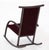 Carlos Riart for Knoll, circa 1982, rocker in stained mahogany with inlaid of mother of pearl on arms and at the top of...