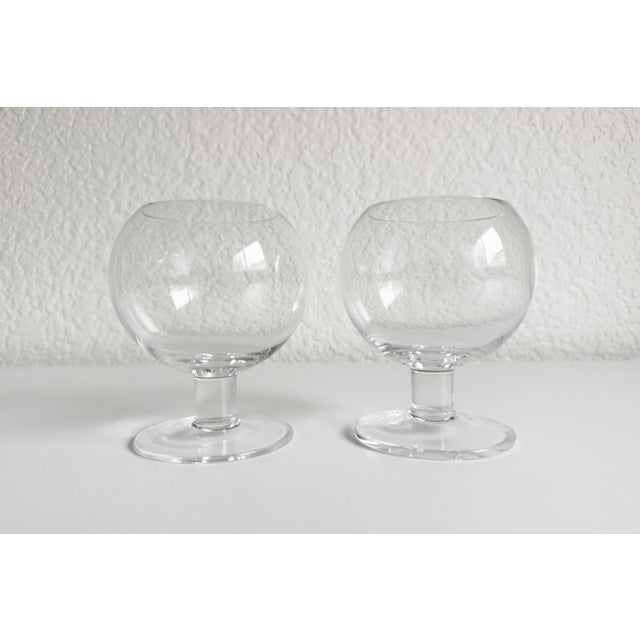 A minimalist pair of Scandinavian-style brandy or cognac snifters featuring a thick stem and spherical bowl. Nice weight...