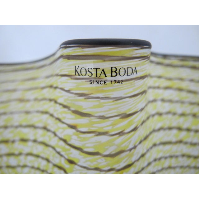 Kosta Boda Swedish "Carmen" lemon yellow handkerchief art glass bowl designed by Ulrica Hydman-Vallien. Distinctive hand-...