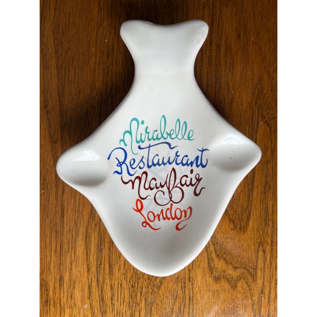 This charming pair of hand-painted fish-shaped faience ashtrays or catchalls are from the famous now closed, Mirabelle...