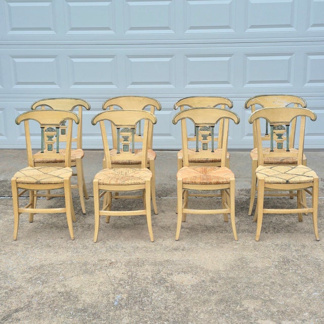 This is a very special set of 8 antique rush seat dining chairs that combines the elegance of neoclassical design with the...