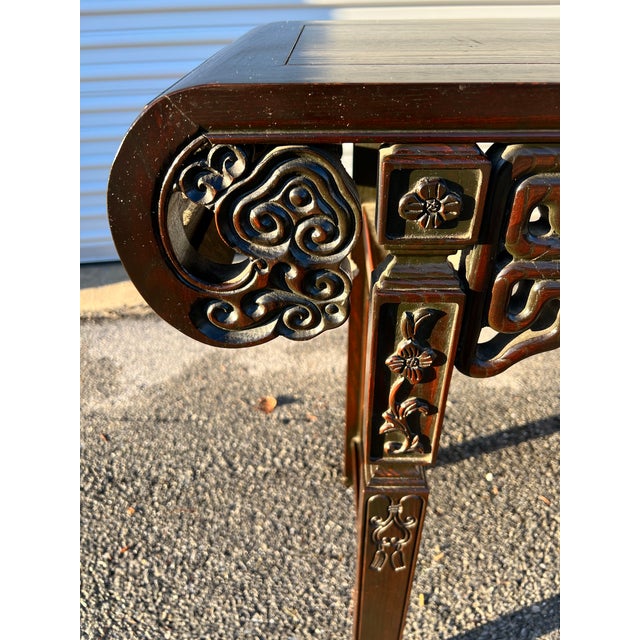 Vintage Ebony Finish Chinoiserie Style Console or Hall Table Circa 1970’s Probably made in the USA, circa 1970’s Carved...