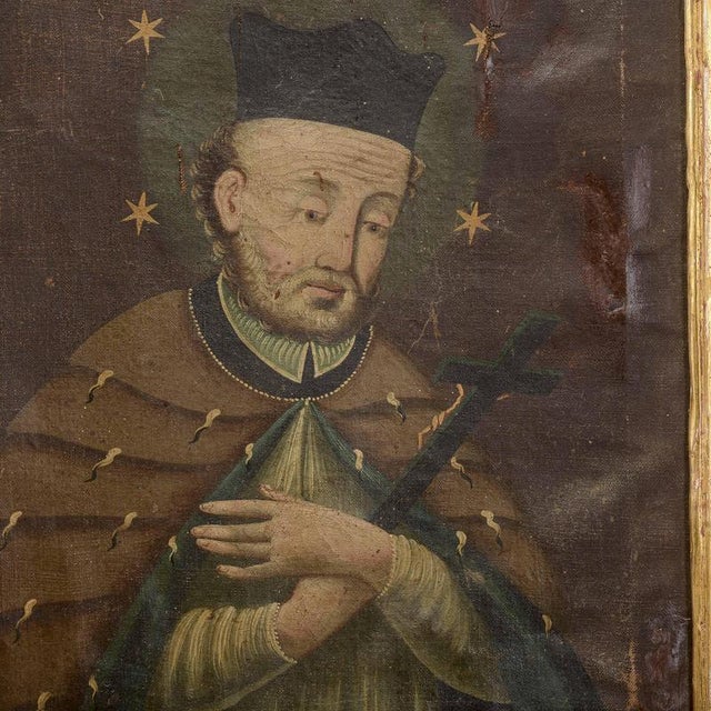 An antique oil painting on canvas depicting a saint, identified as Saint John of Nepomuk, dating from the 18th–19th...