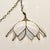 This mid-century modern hanging pendant light in a lotus flower form. Two tiers of sculpted, milk-white slag glass petals...