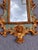 Wood Late Nineteenth Century Italian Rococo Hand Carved Wood Gilded Gold Ornate Florentine Mirrors With Cherubs and Lions, a Pair For Sale - Image 7 of 12