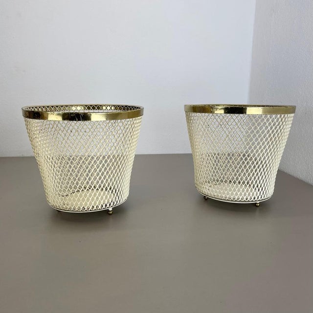 Article: Set of two modernist metal plant pots. Design: Attributed to Mathieu Mategot Origin: France : This original set...