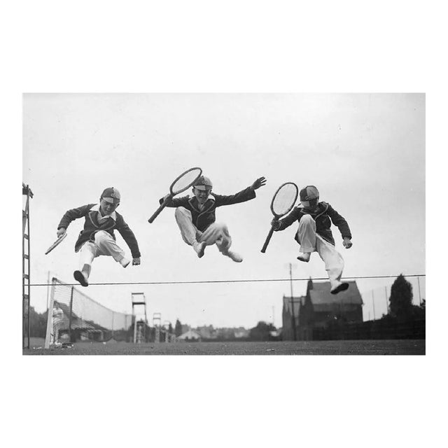 Tennis Leap 22nd August 1932: Three young competitors leaping over the boundary between two tennis courts at the Essex...