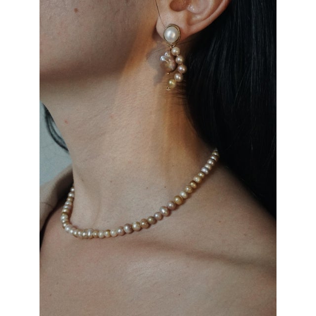 Hand-selected naturally mauve colored Freshwater Pearls, 14K Gold Plated Brass. *Please note each necklace is unique due...