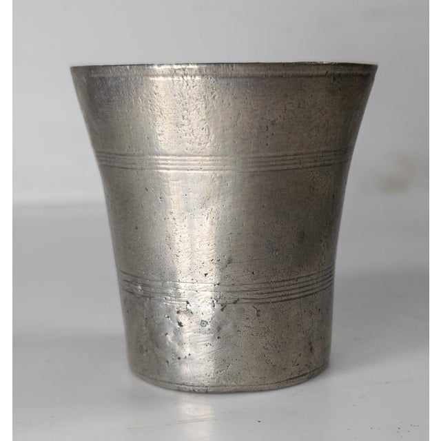 We are selling this interesting Early American beaker. This pewter beaker has simple form and petite size, possibly for a...