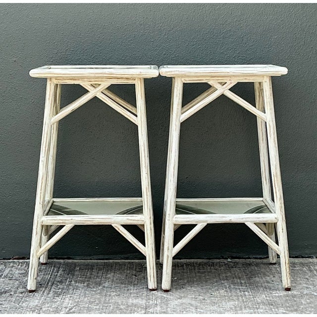 Elevate your interior with this captivating pair of vintage Hollywood Regency side tables, where tropical charm meets...