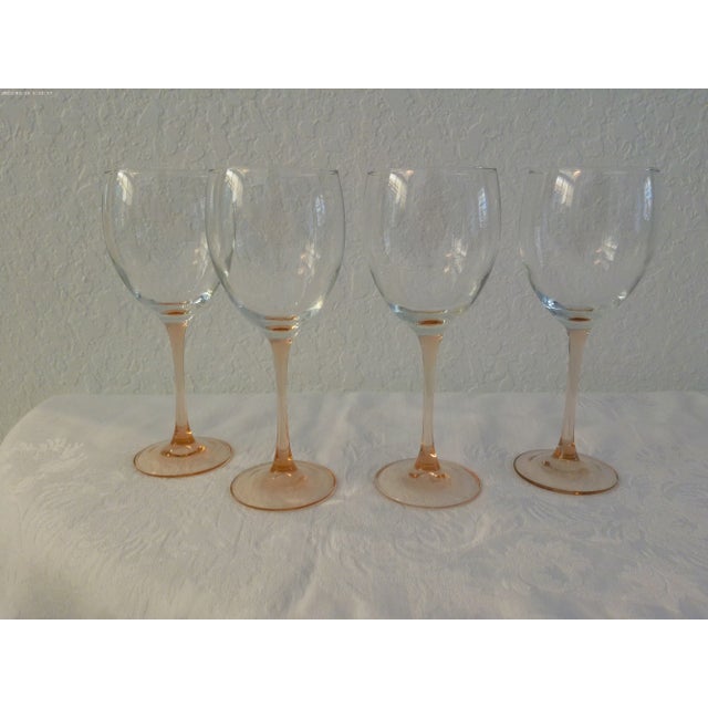 Lovely set of eight pink and Loden green long stem crystal wine glasses. Set consists of four pink stemmed glasses with...
