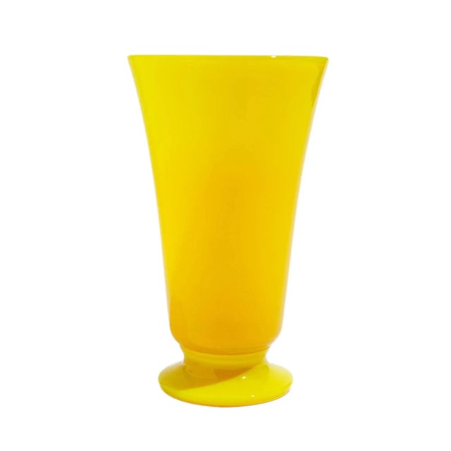 Vintage flared vase in cadmium yellow opaline which rests on a circular foot. American, 20th century.