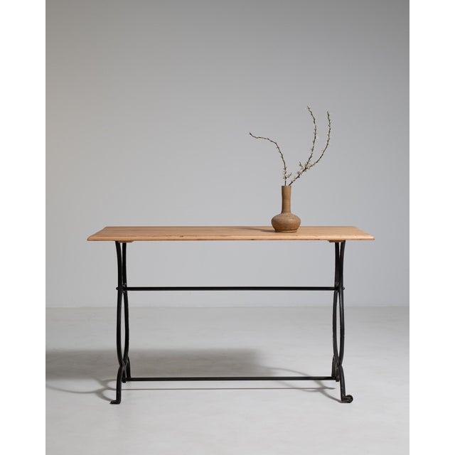 A rare mobile variation of the classic bistro table, featuring casters for easy movement. This design reflects more...