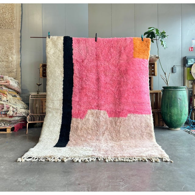 his stunning M'rirt rug is a one-of-a-kind piece hand-knotted by master weavers in the Atlas Mountains of Morocco. Its...