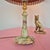 Elegant table lamp crafted from natural onyx and decorative brass elements. Its refined silhouette and noble materials...