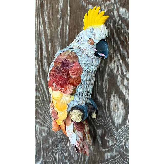 This unique Vintage Coastal Shell Encrusted Cockatoo brings together the beauty of the ocean and nature in a stunning...