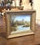 This charming antique landscape painting captures a peaceful English countryside scene with a medieval castle overlooking...
