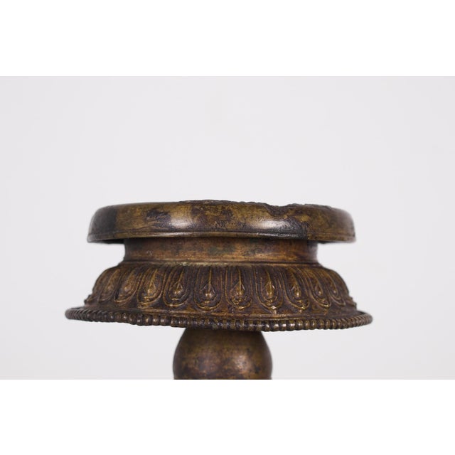 Traditional Nepalese bronze panas (oil lamp), in which an oil-filled wick was placed. Nepal, late 18th/early 19th century....