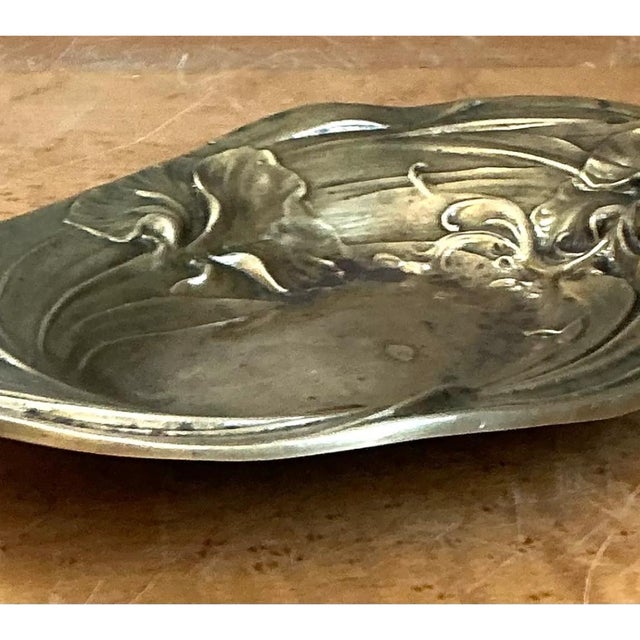 This vintage Art Nouveau brass tray brings early twentieth-century organic design to a compact decorative accent. Made...