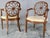 We are offering a pair of elegant spider back or wagon wheel Hepplewhite chairs from the early 20th century. The centre of...