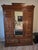 An absolute showstopper of late 19th-century craftsmanship, this magnificent Victorian-era grand wardrobe armoire is a...