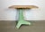 Green industrial table made in former Czechoslovakia during the 1960s. Made of cast iron and wood.