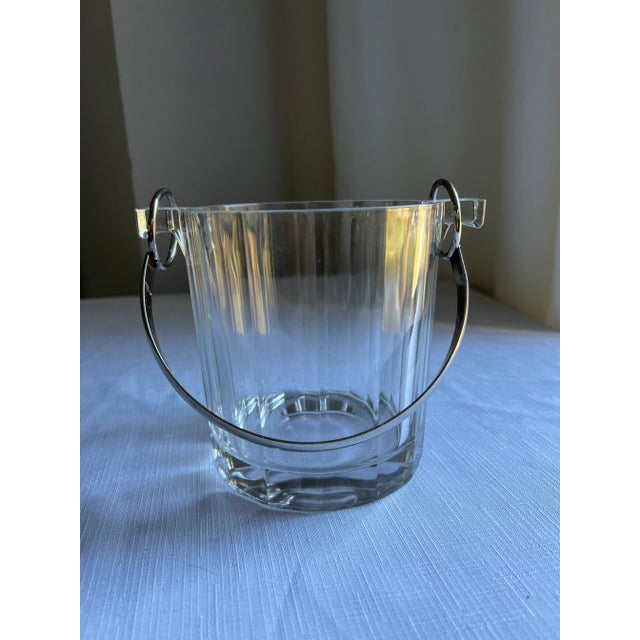 Vintage Mid 20th Century Modern glass ice bucket with metal handle. Measures approximately 6.5” wide and 5.25” tall...